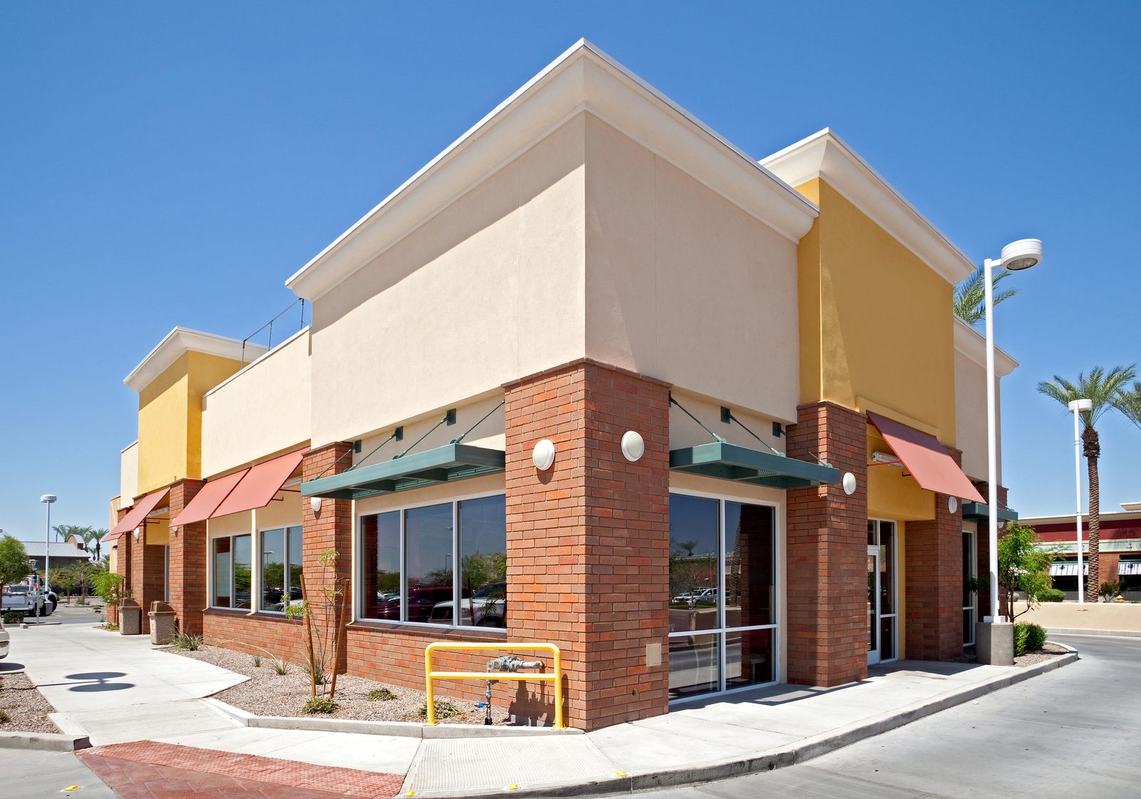 Commercial building exterior with window systems by Klasic Exteriors